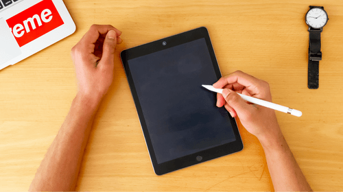 Person Writing On An Ipad Mini