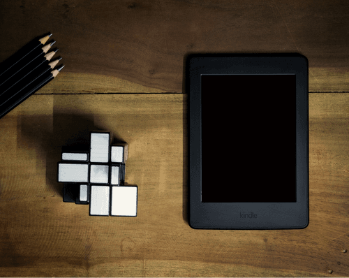 Kindle Mockup On Top Of A Wooden Table