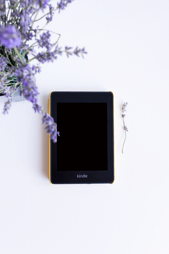 Kindle Mockup Top View With Flowers