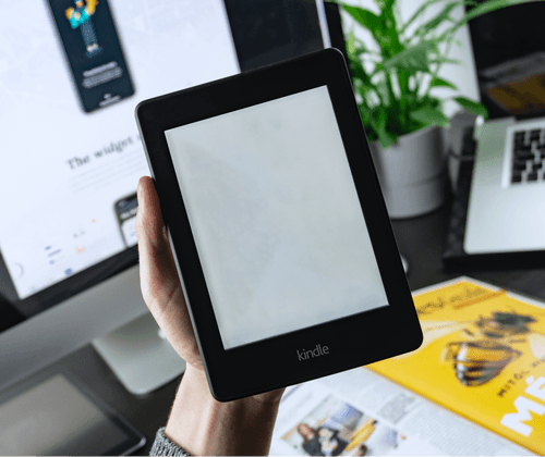 Hand Holding Kindle Mockup
