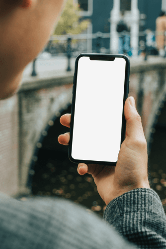 Man Holding Iphone In Hand Mockup