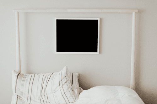 Wooden Square Frame Mockup Over The Bed