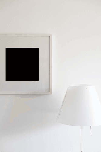 White Frame Mockup Hanging On A Wall