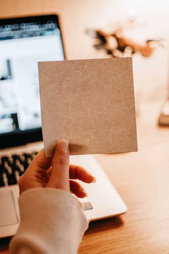 Hand Holding Sticky Note Mockup