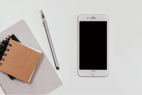 White Iphone Mockup With Notepad