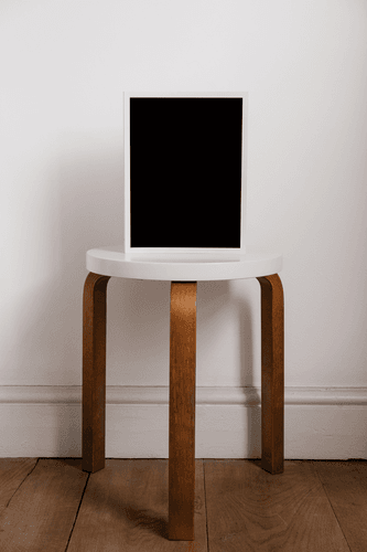 White Frame Mockup On A Table